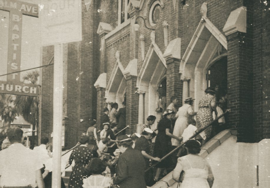 Congregation crowding the front steps of Palm Avenue Baptist Church, mid-century